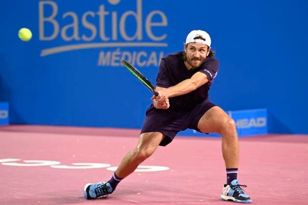 MONTPELLIER, FRANCE - JANUARY 30 : Lucas POUILLE (FRA) during the 1st round of the ATP, Tennis Herren 250 Open Sud de France tournament vs. Harold MAYOT (FRA) in Montpellier, France on January 30th, 2024. TENNIS : Open Sud de France ATP 250 - 30 01 2024 ValentinaClaret Panoramic 