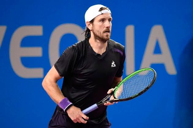 MONTPELLIER, FRANCE - JANUARY 30 : Lucas POUILLE (FRA) during the 1st round of the ATP, Tennis Herren 250 Open Sud de France tournament vs. Harold MAYOT (FRA) in Montpellier, France on January 30th, 2024. TENNIS : Open Sud de France ATP 250 - 30 01 2024 ValentinaClaret Panoramic 