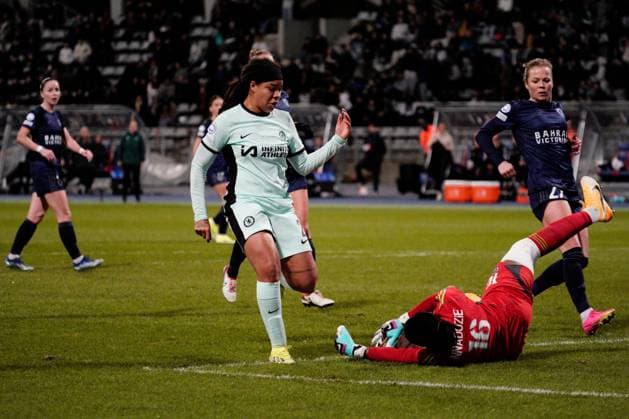 Chiamaka Nnadozie of Paris FC saves at the feet of Mia Fishel of Chelsea Paris FC Feminines v Chelsea Women, Football, UEFA Women s Champions League, Group D, Stade Charlety, Paris, France - 30 Jan 2024 EDITORIAL USE ONLY No use with unauthorised audio, video, data, fixture lists, club league logos or live services. Online in-match use limited to 120 images, no video emulation. No use in betting, games or single club league player publications. Copyright: xDavexWinter Shutterstockx 14324140az