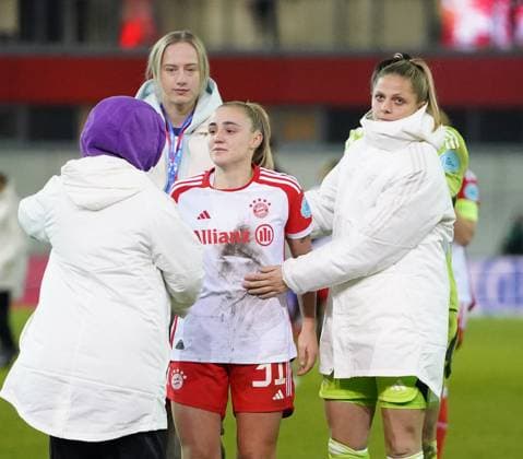 Georgia Stanway 31 FC Bayern is comforted by her teammates after the UEFA Womens Champions League match FC Bayern Munich Paris Saint Germain Feminine on 30 01 2024 Munich FC Bayern Campus Bayern Germany