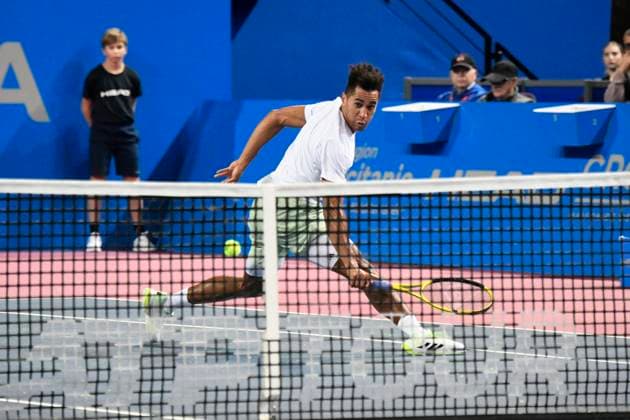 MONTPELLIER, FRANCE - JANUARY 31 : Michael MMOH (USA) during the 2nd round of the ATP, Tennis Herren 250 Open Sud de France tournament vs. Alexandre MULLER (FRA) in Montpellier, France on January 31st, 2024. TENNIS : Open Sud de France ATP 250 - 31 01 2024 ValentinaClaret Panoramic 