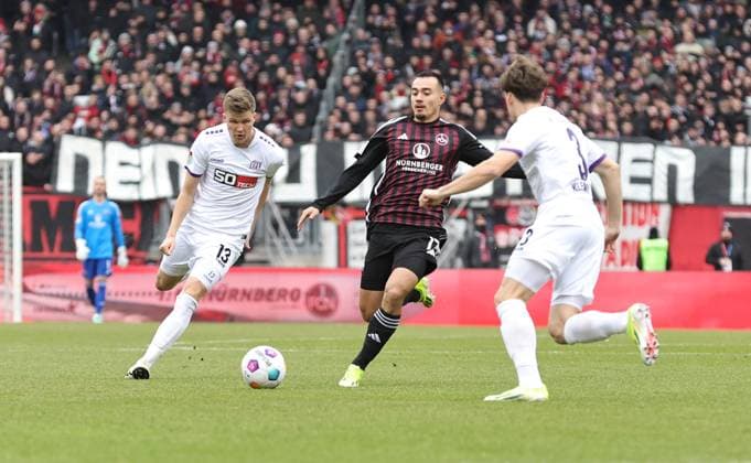 03 02 2024 Soccer Season 2023 2024 2 Soccer Bundesliga 20 Matchday 1 FC Nürnberg FCN Club VfL Osnabrück Sportfoto Zink DaMa xdaxmax DFL regulations prohibit any use of photographs as image sequences and or quasi video only for editorial use Lukas Kunze 13, VfL Osnabrück Jens Castrop 17, 1 FC Nürnberg FCN Florian Kleinhansl 3, VfL Osnabrück