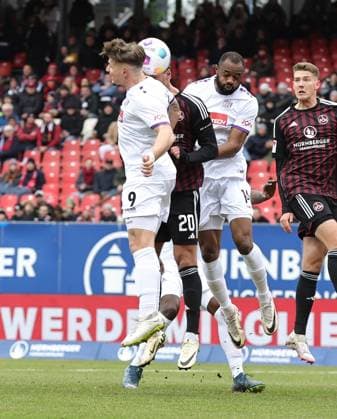03 02 2024 Soccer Season 2023 2024 2 Soccer Bundesliga 20 Matchday 1 FC Nürnberg FCN Club VfL Osnabrück Sportfoto Zink DaMa xdaxmax DFL regulations prohibit any use of photographs as image sequences and or quasi video only for editorial use Sebastian Andersson 20, 1 FC Nürnberg FCN in header duel with Erik Engelhardt 9, VfL Osnabrück Oumar Diakhite 14, VfL Osnabrück
