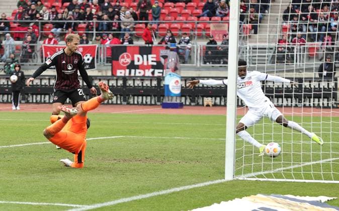 03 02 2024 Soccer Season 2023 2024 2 Soccer Bundesliga 20 Matchday 1 FC Nürnberg FCN Club VfL Osnabrück Sportfoto Zink DaMa xdaxmax DFL regulations prohibit any use of photographs as image sequences and or quasi video only for editorial use Christian Conteh 17, VfL Osnabrück saves goal shot by Lukas Schleimer 36, 1 FC Nürnberg FCN, not in the picture on the line