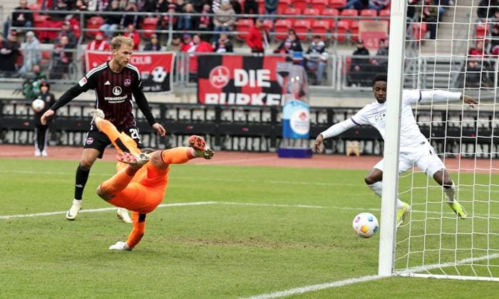 03 02 2024 Soccer Season 2023 2024 2 Soccer Bundesliga 20 Matchday 1 FC Nürnberg FCN Club VfL Osnabrück Sportfoto Zink DaMa xdaxmax DFL regulations prohibit any use of photographs as image sequences and or quasi video only for editorial use Christian Conteh 17, VfL Osnabrück saves goal shot by Lukas Schleimer 36, 1 FC Nürnberg FCN, not in the picture on the line