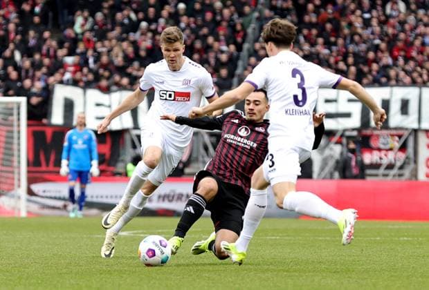 03 02 2024 Soccer Season 2023 2024 2 Soccer Bundesliga 20 Matchday 1 FC Nürnberg FCN Club VfL Osnabrück Sportfoto Zink DaMa xdaxmax DFL regulations prohibit any use of photographs as image sequences and or quasi video only for editorial use Lukas Kunze 13, VfL Osnabrück Jens Castrop 17, 1 FC Nürnberg FCN Florian Kleinhansl 3, VfL Osnabrück