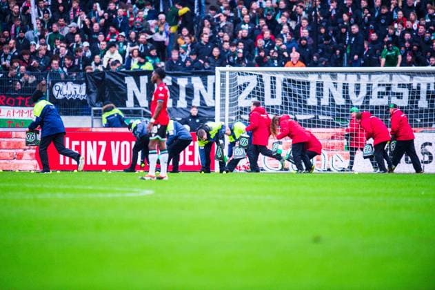 04 02 2024 Football, 2023 2024, 1 Bundesliga, Matchday 20, Hannover 96 FC Hansa Rostock Fans Hannover throw tennis balls in protest against the DFL, German Football League stewards remove them from the sidelines DFL REGULATIONS PROHIBIT ANY USE OF PHOTOGRAPHS AS IMAGE SEQUENCES AND OR QUASI VIDEO