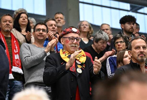 Volleyball 2 Bundesliga season 2023 2024 TV Rottenburg SV Schwaig 04 02 2024 Decorative picture, carnival in Rottenburg, fans partly dressed up in the hall, Manfred Alisch in the middle as a clown