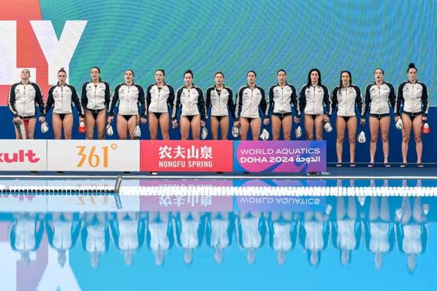 Athlese of team Italy line up before the Water polo, Wasserball women match between team Italy (white caps) and team Canada (blue caps) of the 21st World Aquatics Championships at the Aspire Dome in Doha (Qatar), February 8, 2024. GiorgioXScala