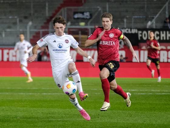Benjamin Goller 1 FC Nuernberg, 14 in duel with Marcus Mathisen SV Wehen Wiesbaden, 24 , GER, SV Wehen Wiesbaden vs 1 FC Nuernberg, Soccer, 2 Bundesliga, Matchday 21, Season 2023 2024, 09 02 2024 DFL REGULATES PROHIBIT ANY USE OF PHOTOGRAPHS AS IMAGE SEQUENCES AND OR QUASI VIDEO GER, SV Wehen Wiesbaden vs 1 FC Nuernberg, Football, 2 Bundesliga, Matchday 21, Season 2023 2024, 09 02 2024 Wiesbaden Copyright: xEibner-Pressefoto FlorianxWieganx EP_FWD