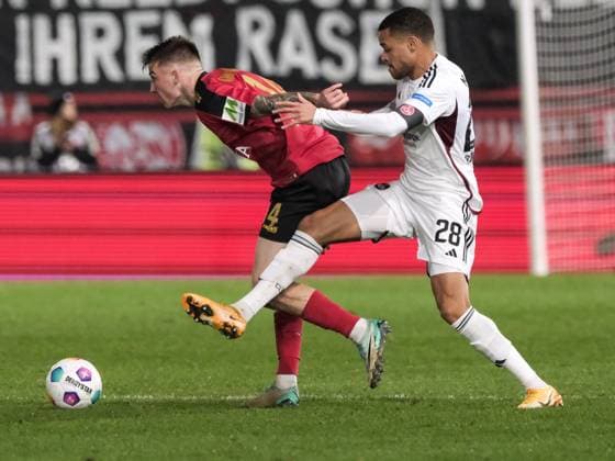 Franko Kovacevic SV Wehen Wiesbaden, 14 in duel with Jan Gyamerah 1 FC Nuernberg, 28 , GER, SV Wehen Wiesbaden vs 1 FC Nuernberg, Soccer, 2 Bundesliga, Matchday 21, Season 2023 2024, 09 02 2024 DFL REGULATES PROHIBIT ANY USE OF PHOTOGRAPHS AS IMAGE SEQUENCES AND OR QUASI VIDEO GER, SV Wehen Wiesbaden vs 1 FC Nuernberg, Football, 2 Bundesliga, Matchday 21, Season 2023 2024, 09 02 2024 Wiesbaden Copyright: xEibner-Pressefoto FlorianxWieganx EP_FWD