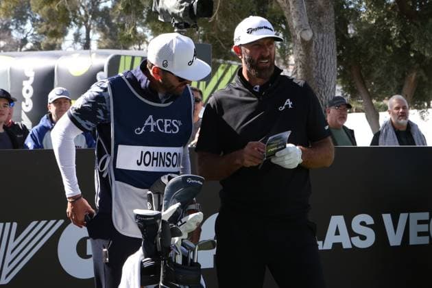 LAS VEGAS, NV - FEBRUARY 09: Dustin Johnson of 4ACES GC checks the yardage with his caddy prior to teeing off during the LIV Golf League tournament on February 09, 2024 at the Las Vegas Country Club in Las Vegas, NV. (Photo by Matthew Bolt Icon Sportswire) GOLF: FEB 09 LIV Golf League Las Vegas EDITORIAL USE ONLY Icon240209192097