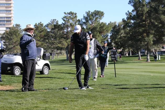 LAS VEGAS, NV - FEBRUARY 10: Dustin Johnson captain of 4Aces GC requests relief from a LIV Golf official from the fairway rough during the final round of the LIV Golf League tournament on February 10, 2024 at the Las Vegas Country Club in Las Vegas, NV. (Photo by Matthew Bolt Icon Sportswire) GOLF: FEB 10 LIV Golf League Las Vegas EDITORIAL USE ONLY Icon240210194288