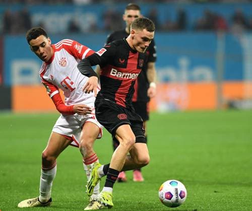 10 02 2024, Leverkusen, Germany, BayArena, Bayer Leverkusen vs FC Bayern Muenchen 1 Bundesliga, Jamal Musiala FC Bayern Muenchen and Florian Wirtz Bayer 04 Leverkusen in a duel Photo Ralf Treese DFB DFL REGULATIONS PROHIBIT ANY USE OF PHOTOGRAPHS AS IMAGE SEQUENCES AND OR QUASI VIDEO Leverkusen BayArena North Rhine Westphalia Germany 521_LEVFCB20240210_130 Treese-521
