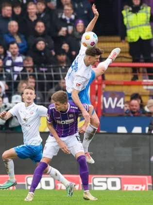 Lukas Kunze VfL Osnabrueck and Alexander Rossipal Hansa Rostock fight for the ball, 2 Bundesliga, VfL Osnabrueck vs Hansa Rostock, Bremer Bruecke, 11 02 2024, Osnabrueck, Germany