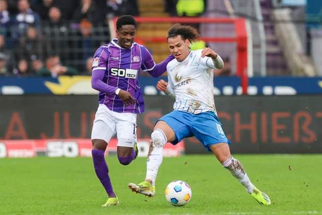 Christian Conteh VfL Osnabrueck and Juan Jose Perea Hansa Rostock fight for the ball, 2 Bundesliga, VfL Osnabrueck vs Hansa Rostock, Bremer Bruecke, 11 02 2024, Osnabrueck, Germany