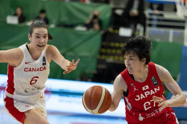 (240212) -- SOPRON, Feb. 12, 2024 -- Hayashi Saki (R) of Japan vies with Shay Colley of Canada during the match between Canada and Japan at the FIBA Women s Olympic qualifying tournament in Sopron, Hungary on Feb. 11, 2024. (Photo by Xinhua) (SP) HUNGARY-SOPRON-BASKETBALL-FIBA WOMEN S OLYMPIC QUALIFIERS-CANADA VS JAPAN AttilaxVolgyi 