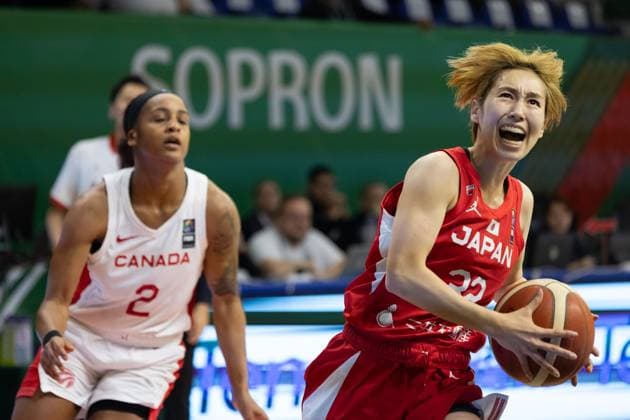 (240212) -- SOPRON, Feb. 12, 2024 -- Miyazaki Saori (R) of Japan vies with Shay Colley of Canada during the match between Canada and Japan at the FIBA Women s Olympic qualifying tournament in Sopron, Hungary on Feb. 11, 2024. (Photo by Xinhua) (SP) HUNGARY-SOPRON-BASKETBALL-FIBA WOMEN S OLYMPIC QUALIFIERS-CANADA VS JAPAN AttilaxVolgyi 