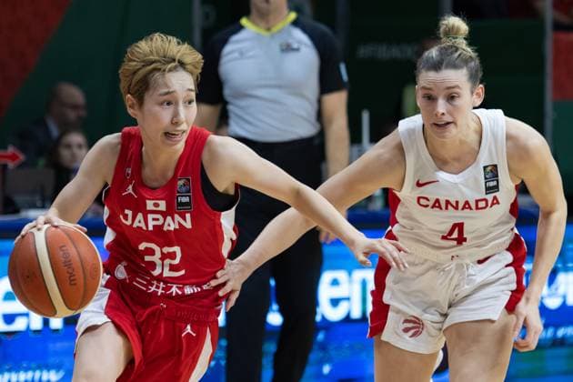 (240212) -- SOPRON, Feb. 12, 2024 -- Miyazaki Saori L) of Japan vies with Sami Hill of Canada during the match between Canada and Japan at the FIBA Women s Olympic qualifying tournament in Sopron, Hungary on Feb. 11, 2024. (Photo by Xinhua) (SP) HUNGARY-SOPRON-BASKETBALL-FIBA WOMEN S OLYMPIC QUALIFIERS-CANADA VS JAPAN AttilaxVolgyi 