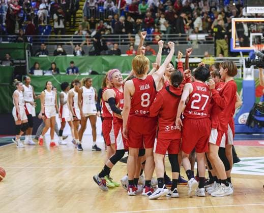 Basketball: Olympic women s qualifier Members of Japan women s basketball team celebrate after qualifying for the 2024 Paris Olympics by defeating Canada in a four-team qualifying tournament on Feb. 11, 2024, in Sopron, Hungary.  A14AA0002454704P