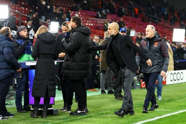 Manchester City manager Pep Guardiola greets TNT Sports pundits FC Copenhagen v Manchester City, UEFA Champions League, Round of 16, First Leg, Football, Parken Stadium, Copenhagen, Denmark - 13 Feb 2024 EDITORIAL USE ONLY No use with unauthorised audio, video, data, fixture lists, club league logos or live services. Online in-match use limited to 120 images, no video emulation. No use in betting, games or single club league player publications. Copyright: xKieranxMcManus Shutterstockx 14343227h