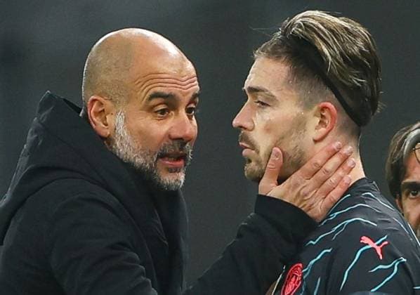 Manchester City manager Pep Guardiola speaks with a dejected Jack Grealish of Manchester City on the sideline FC Copenhagen v Manchester City, UEFA Champions League, Round of 16, First Leg, Football, Parken Stadium, Copenhagen, Denmark - 13 Feb 2024 EDITORIAL USE ONLY No use with unauthorised audio, video, data, fixture lists, club league logos or live services. Online in-match use limited to 120 images, no video emulation. No use in betting, games or single club league player publications. Copyright: xKieranxMcManus Shutterstockx 14343227aq