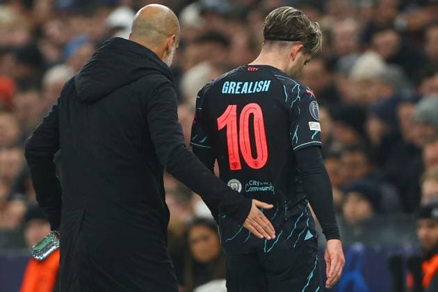 Jack Grealish of Manchester City leaves the pitch after an injury and is consoled by Manchester City manager Pep Guardiola FC Copenhagen v Manchester City, UEFA Champions League, Round of 16, First Leg, Football, Parken Stadium, Copenhagen, Denmark - 13 Feb 2024 EDITORIAL USE ONLY No use with unauthorised audio, video, data, fixture lists, club league logos or live services. Online in-match use limited to 120 images, no video emulation. No use in betting, games or single club league player publications. Copyright: xKieranxMcManus Shutterstockx 14343227aw
