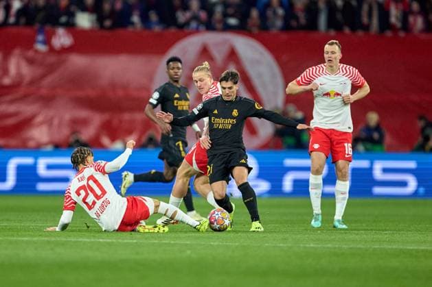 13 02 2024, Football, Men, Champions League, Round of 16, 2023 2024, First leg, RB Leipzig Real Madrid Xavi Simons 20, RB Leipzig , Action, Tackle against Brahim Diaz 21, Real Madrid Leipzig Red Bull Arena Saxony Germany