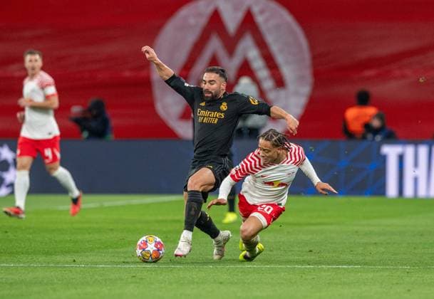 Football, Men, Season 2023 2024, UEFA Champions League Round of 16, First leg , RB Leipzig Real Madrid, v l Daniel Carvajal Real Madrid , Xavi Simons RB Leipzig , 13 02 2024, Copyright: xSebastianxRäppold MatthiasxKochx