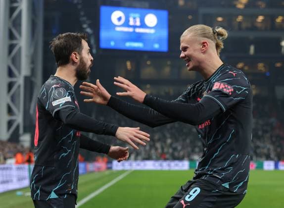 Copenhagen, Denmark, 13th February 2024. Bernardo Silva (L) of Manchester City celebrates with Erling Haaland after scoring to make it 2-1 during the UEFA Champions League match at Telia Parken, Copenhagen. Picture credit should read: Paul Terry Sportimage EDITORIAL USE ONLY. No use with unauthorised audio, video, data, fixture lists, club league logos or live services. Online in-match use limited to 120 images, no video emulation. No use in betting, games or single club league player publications. SPI-2935-0029