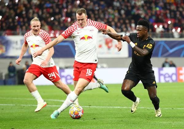 13 02 2024, xtgx, Football UEFA Champions League 1 8 Final, RB Leipzig Real Madrid emspor, v l Xaver Schlager RB Leipzig , Lukas Klostermann RB Leipzig , Vinicius Junior Real Madrid DFL DFB REGULATIONS PROHIBIT ANY USE OF PHOTOGRAPHS as IMAGE SEQUENCES and or QUASI VIDEO Leipzig