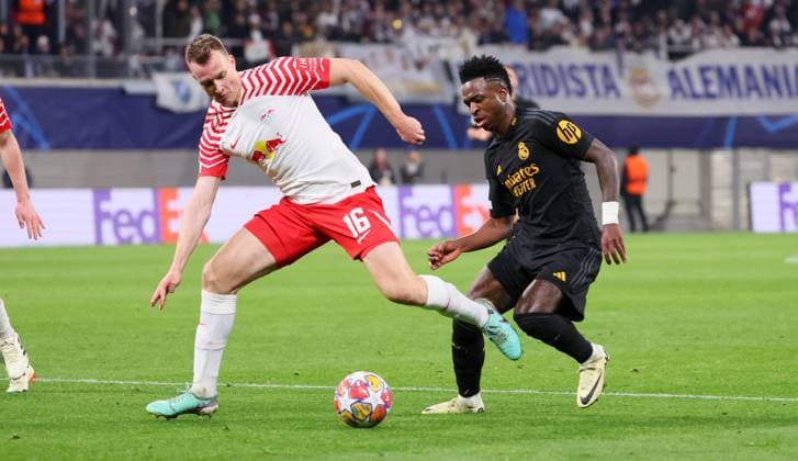 RB Leipzig Real Madrid Champions League Leipzig, 13 02 2024, Red Bull Arena, Football, UEFA Champions League, Round of 16 , RB Leipzig vs Real Madrid , In the picture from left Lukas Klostermann 16, RB Leipzig , Vinicius Junior 7, Real , Only editorial use , UEFA regulations prohibit any use of photographs as image sequences and or quasi video ,