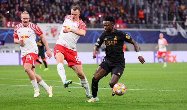 RB Leipzig Real Madrid Champions League Leipzig, 13 02 2024, Red Bull Arena, Football, UEFA Champions League, Round of 16 , RB Leipzig vs Real Madrid , Pictured from left Xaver Schlager 24, RB Leipzig ,Lukas Klostermann 16, RB Leipzig , Vinicius Junior 7, Real , Only editorial use , UEFA regulations prohibit any use of photographs as image sequences and or quasi video ,