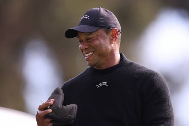 February 13, 2024, Pacific Palisades, California, USA: TIGER WOODS smiles after playing a shot from the tee box of the 14th hole during a Tuesday practice round of the The Genesis Invitational in Pacific Palisades, California Pacific Palisades USA - ZUMAt158 20240213_zsp_t158_024 Copyright: xBrentonxTsex