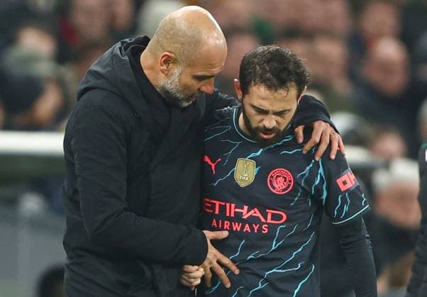 Manchester City manager Pep Guardiola consoles an injured Bernardo Silva of Manchester City FC Copenhagen v Manchester City, UEFA Champions League, Round of 16, First Leg, Football, Parken Stadium, Copenhagen, Denmark - 13 Feb 2024 EDITORIAL USE ONLY No use with unauthorised audio, video, data, fixture lists, club league logos or live services. Online in-match use limited to 120 images, no video emulation. No use in betting, games or single club league player publications. Copyright: xKieranxMcManus Shutterstockx 14343227co