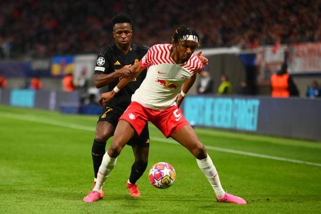 Leipzig, GERMANY - 13.02.24: Mohamed Simakan, Vinicius Junior, The match of match UEFA Champion League RB Leipzig vs Real Madrid at Red Bull Arena  Copyright: xVITALIIxKLIUIEVx