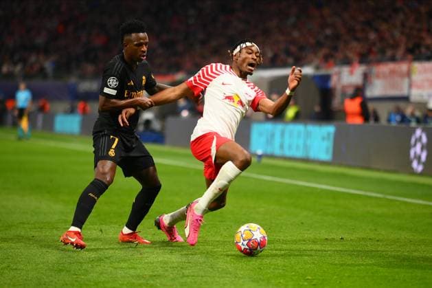 Leipzig, GERMANY - 13.02.24: Mohamed Simakan, Vinicius Junior, The match of match UEFA Champion League RB Leipzig vs Real Madrid at Red Bull Arena  Copyright: xVITALIIxKLIUIEVx