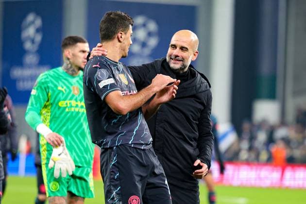 FC Copenhagen v Manchester City Champions League 13 02 2024. Pep Guardiola Manager of Manchester City hugs Rodri (16) of Manchester City at full time during the Champions League match between FC Copenhagen and Manchester City at Parken Stadium, Copenhagen, Denmark on 13 February 2024. Editorial use only , Copyright: xNigelxKeenex PSI-19018-0068