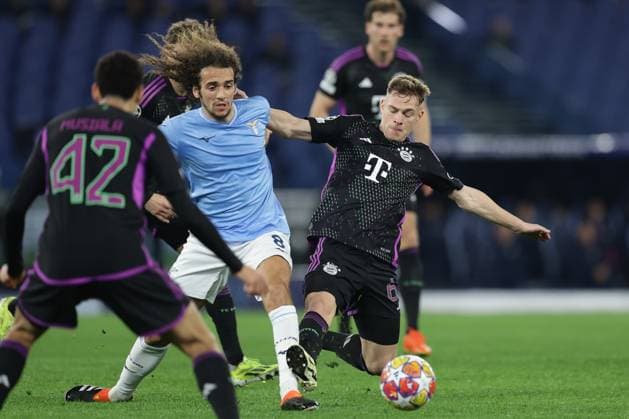 UEFA Champions League SS Lazio vs Bayern Munich Lazio s French midfielder Matteo Guendouzi challenges for the ball with Bayern Munich s German midfielder Joshua Kimmich during the UEFA Champions League Round of 16, first-leg football match between SS Lazio vs Bayern Munich in Rome, on February 14, 2024. ABPH6978 Copyright: xAntonioxBalascox