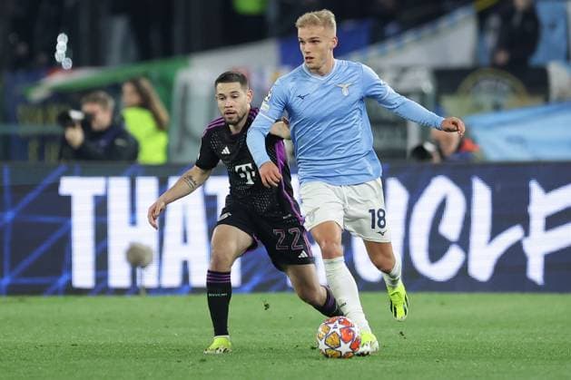 UEFA Champions League SS Lazio vs Bayern Munich Lazio™s Danish midfielder Gustav Isaksen challenges for the ball with Bayern Munich s Portuguese defender Raphael Guerreiro during the UEFA Champions League Round of 16, first-leg football match between SS Lazio vs Bayern Munich in Rome, on February 14, 2024. ABPH7383 Copyright: xAntonioxBalascox