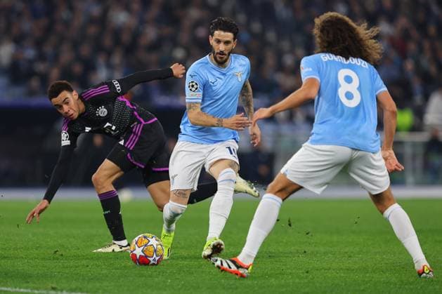 UEFA CHAMPIONS LEAGUE 2023-2024 - Round 16 - SS Lazio vs Bayern Munchen, Olympic Stadium in Rome Rome, Italy 14.2.2024: Jamal Musiala of Bayern Munchen, Luis Alberto of Lazio in action during the Uefa Champions League 2023-2024, round of 16 football match SS Lazio vs FC Bayern Mucnhen at Olympic Stadium in Rome. Rome Olympic italy italy Copyright: xmarcoxiacobucci