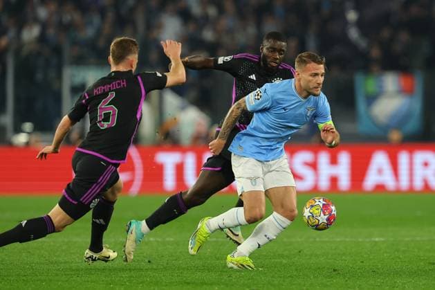UEFA CHAMPIONS LEAGUE 2023-2024 - Round 16 - SS Lazio vs Bayern Munchen, Olympic Stadium in Rome Rome, Italy 14.2.2024: Ciro Immobile of Lazio , Joshua Kimmich of Bayern Munchen in action during the Uefa Champions League 2023-2024, round of 16 football match SS Lazio vs FC Bayern Mucnhen at Olympic Stadium in Rome. Rome Olympic italy italy Copyright: xmarcoxiacobucci