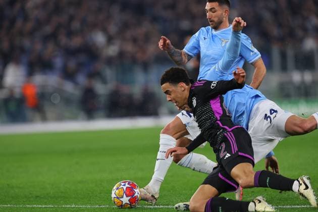 UEFA CHAMPIONS LEAGUE 2023-2024 - Round 16 - SS Lazio vs Bayern Munchen, Olympic Stadium in Rome Rome, Italy 14.2.2024: Jamal Musiala of Bayern Munchen, Maria Gila of Lazio in action during the Uefa Champions League 2023-2024, round of 16 football match SS Lazio vs FC Bayern Mucnhen at Olympic Stadium in Rome. Rome Olympic italy italy Copyright: xmarcoxiacobucci