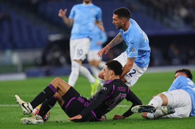 UEFA CHAMPIONS LEAGUE 2023-2024 - Round 16 - SS Lazio vs Bayern Munchen, Olympic Stadium in Rome Rome, Italy 14.2.2024: Jamal Musiala of Bayern Munchen, Maria Gila of Lazio in action during the Uefa Champions League 2023-2024, round of 16 football match SS Lazio vs FC Bayern Mucnhen at Olympic Stadium in Rome. Rome Olympic italy italy Copyright: xmarcoxiacobucci