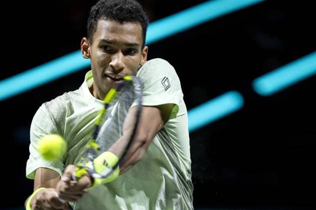 ROTTERDAM - Felix Auger-Aliassime (CAN) in action against Andrey Rublev (RUS) on the third day of the ABN AMRO Open tennis tournament in Ahoy. ANP SANDER KONING Third day 2024 xVIxANPxSportx xxANPxIVx 491128144 originalFilename: 491128144.jpg