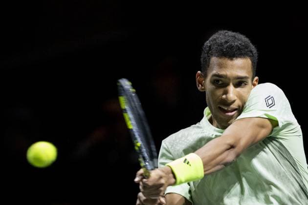 ROTTERDAM - Felix Auger-Aliassime (CAN) in action against Andrey Rublev (RUS) on the third day of the ABN AMRO Open tennis tournament in Ahoy. ANP SANDER KONING Third day 2024 xVIxANPxSportx xxANPxIVx 491128159 originalFilename: 491128159.jpg