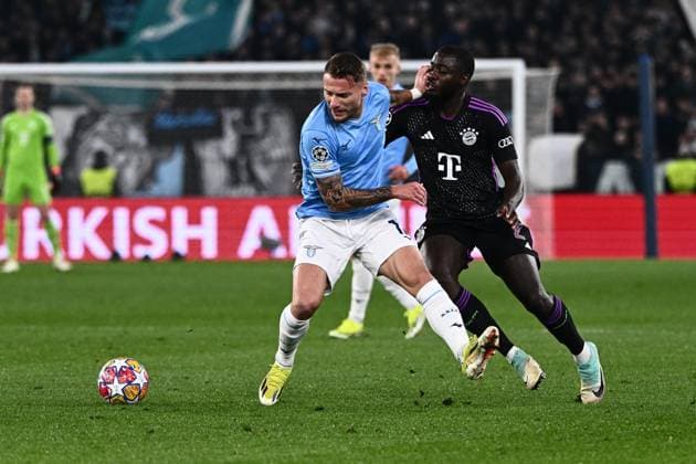 Ciro Immobile of SS Lazio and Dayot Upamecano of FC Bayern Munchen compete for the ball during the Uefa Champions League match between SS Lazio and FC Bayern Munchen at Stadio Olimpico Rome Italy on 14 February 2024. Photo Nicola Ianuale Rome Stadio Olimpico Rome Italy Copyright: xNicolaxIanualex SP24-848-010