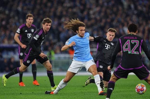 UEFA CHAMPIONS LEAGUE 2023-2024 - Round 16 - SS Lazio vs Bayern Munchen, Olympic Stadium in Rome Rome, Italy 14.2.2024: Guendouzi of Lazio , Joshua Kimmich of Bayern Munchen in action during the Uefa Champions League 2023-2024, round of 16 football match SS Lazio vs FC Bayern Mucnhen at Olympic Stadium in Rome. Rome Olympic italy italy Copyright: xmarcoxiacobucci