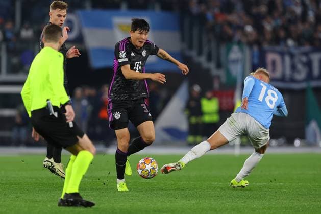 UEFA CHAMPIONS LEAGUE 2023-2024 - Round 16 - SS Lazio vs Bayern Munchen, Olympic Stadium in Rome Rome, Italy 14.2.2024: Minjae Kim of Bayern Munchen, Gustav Isaksen of Lazio in action during the Uefa Champions League 2023-2024, round of 16 football match SS Lazio vs FC Bayern Mucnhen at Olympic Stadium in Rome. Rome Olympic italy italy Copyright: xmarcoxiacobucci