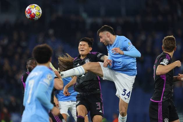 UEFA CHAMPIONS LEAGUE 2023-2024 - Round 16 - SS Lazio vs Bayern Munchen, Olympic Stadium in Rome Rome, Italy 14.2.2024: Minjae Kim of Bayern Munchen, Maria Gila of Lazio in action during the Uefa Champions League 2023-2024, round of 16 football match SS Lazio vs FC Bayern Mucnhen at Olympic Stadium in Rome. Rome Olympic italy italy Copyright: xmarcoxiacobucci